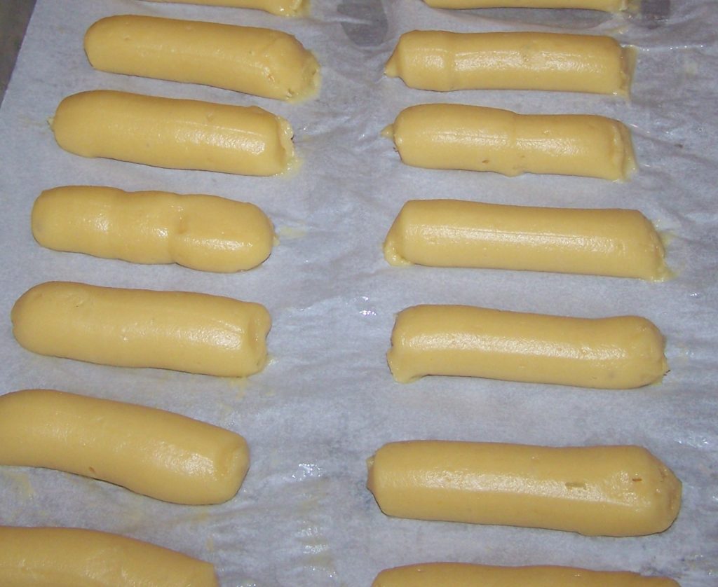 pipped eclairs on parchment paper